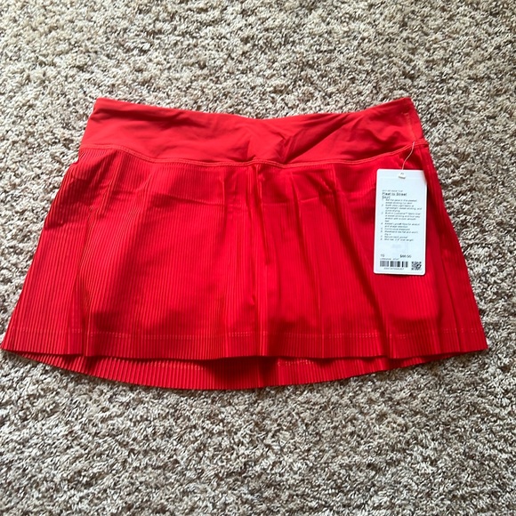 Lululemon pleat to street skirt. NEW. Never worn. Red, size 10 - Picture 1 of 5